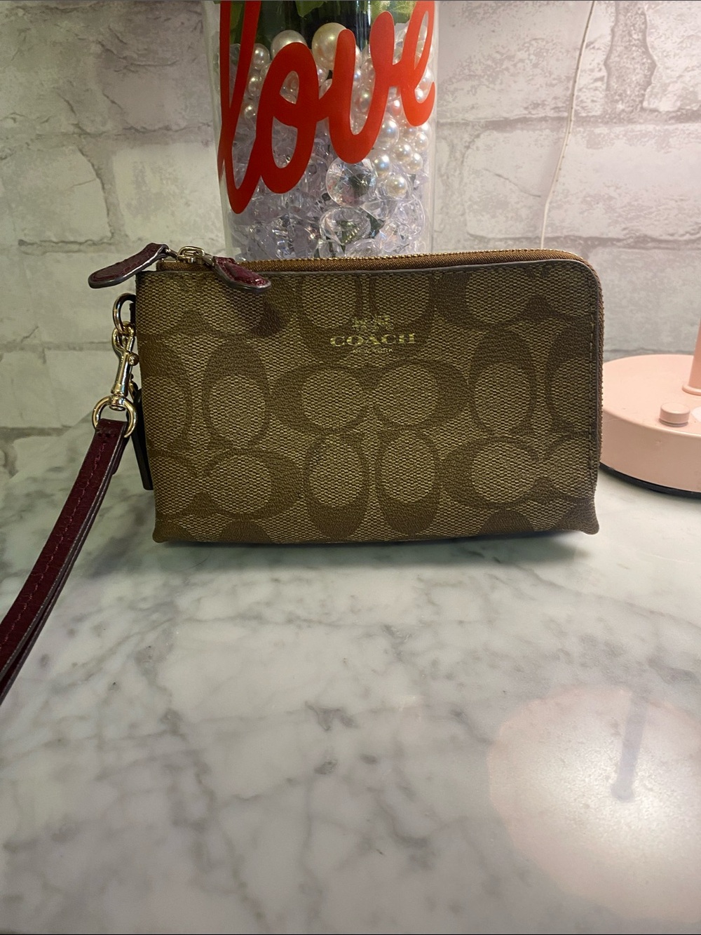 COACH Signature Canvas Wristlet in Brown with Burgundy Strap